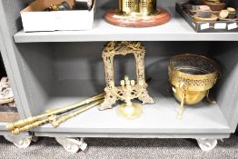 An early 20th brass Jardiniere having a pierced top rim and raised on 3 paw supports, h20cm, sold