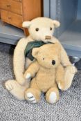 A vintage fully jointed teddy bear having green bow tie, h29cm, sold together with another teddy