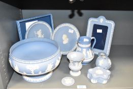 A Wedgwood blue and white Jasperware bowl, decorated with classical figures and foliage, impressed