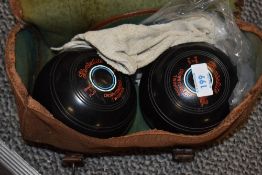 A pair of Hemselite high density bowling balls with carry bag, (2)