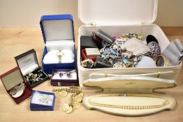A large cream faux crocodile skin jewellery box, containing a large collection of costume jewellery,