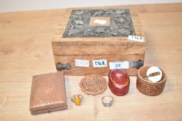 A decorative wooden box, of square hinged form having decorative white metal vine motif decals,