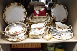 A Royal Albert Old Country Rose pattern part dinner service, decorated with gilt edge and floral