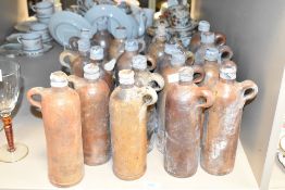A group of 18 late 19th century Apollinaris bottles each having impressed mark 'No.43 B', h24cm.
