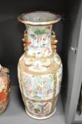 A large 19th century Chinese Famille Rose pottery vase of baluster form, decorated with reserves