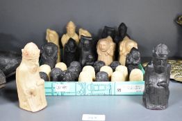 A 32 piece resin medieval chest set, the Kings accompanied eitherside with hounds and falcon, (32)