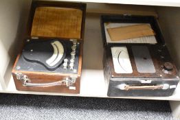 A vintage brown Bakelite volt testing set, w30cm, sold together with a amp tester, (2)