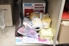 A Naaimachine battery operated sewing machine, sold together with crochet threads, magazines and