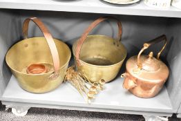 A pair of brass jam pans, w30cm, sold together with a copper kettle and two candle sconces, (5)