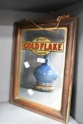 A vintage Will's Gold Flake Cigarettes advertising mirror within a moulded oak frame, 41cm x 31cm