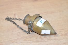 A vintage brass plumb bob with chain 12cm