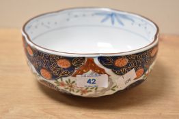 A decorative Japanese Imari porcelain bowl, of lobed circular form and decorated in the typical