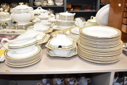 A Myott and Son Imperial pattern porcelain dinner service, having orange edges and yellow border,