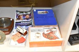 A Cunrad Jig-Saw puzzle of the R.M.S Mauretania leaving New York, size 29'' x 8'', sold together