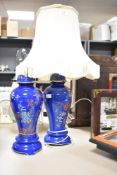 An early 20th century Wilton ware ceramic table lamp of baluster form, decorated with foliage on a