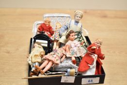 A group of eight miniature dolls and a selection of mixed dolls house furniture /effects