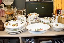 A Royal Worcester Evesham pattern porcelain dinner part service, decorated with gold colour edging