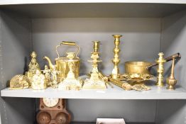 A pair of brass candlesticks having floral decoration, h15cm, sold together with a selection of