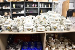 A Villeroy & Boch Basket pattern dinner service, decorated with fruit and foliage on a white ground,