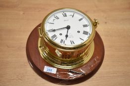 A 20th century Hermle brass marine ship's bell bulkhead clock with Quartz movement and Roman