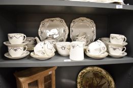 A Wellington China (J.H Cope & Co) gilt and monochrome transfer printed tea set, twelve cups, eleven