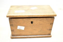 A small 19th century oak box having exposed dove tail joints and plinth base, L17cm x H11cm