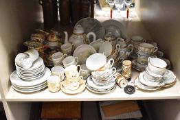 A vintage Chinese fine porcelain tea service, hand coloured with tropical birds, foliage and