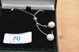 A silver and cultured pearl necklace, the silver snake link chain having two drops, each having a
