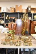 An early 20th century brass fireside tool set, h50cm, sold together with a copper kettle, a pair