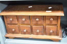 A 20th century 8 drawer wooden apothecary cabinet, L44cm