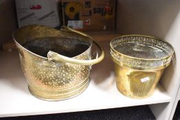 A late 19th / early 20th brass coal helmet, h23cm, sold together with a brass planter, (2)