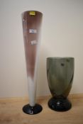 A large and heavy smoked glass vase, of tapering cylindrical form, spirally fluted with spreading