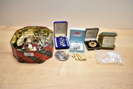 An assortment of costume jewellery, including wristwatches, faux pearls, brooches and statement