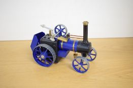 A Mamod Live Steam Traction Engine, blue and brass, with bucket present