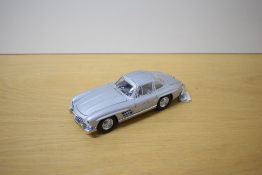A 1987 Franklin Mint 1:24 scale Die-cast, 1954 Mercedes-Benz 300SL with tag and two Letters