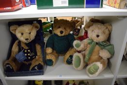 Four Harrods Year Teddy Bears, 1995 wearing green tie, 1997 wearing red tie with tag, 1998 wearing