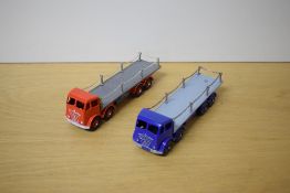 Two repainted Dinky Foden Flat Bed Wagons with Chains, in red and blue both with grey beds