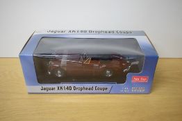 A Sun Star 1:18 scale die-cast, Jaguar XK140 Drophead Coupe, in window display box