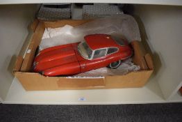 A 1964 Monogram Models Inc plastic scale model, Jaguar E Type, made up with two loose front wheels