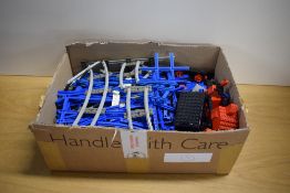 Lego Rail Track in blue and grey with a 7720 Diesel Freight Train with driver and wagons