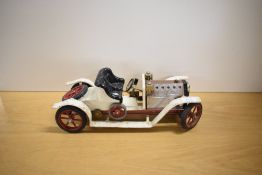 A Mamod Live Steam SA1 Roadster in white with black seat, burner tray present