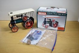 A Mamod Steam 4 Fun Live Steam TE1A Steam Tractor in traditional colours with white canopy Fred
