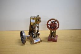 A AJR Brass live steam model of a vertical cylinder engine, height 15cm, diameter of flywheel 7.5cm,