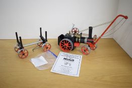A Mamod Steam 4 Fun Live Steam Tractor and Timber Wagon, made up from a kit, crane attached, 6 piece