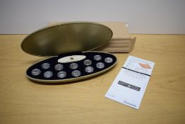 A Royal Canadian Mint 1999 Millennium Silver Proof Coin Set, January to December 25 Cents, each coin