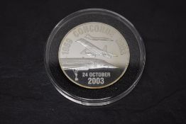 A Westminster Mint 2003 2oz Silver Commemorative of Concorde's Last Flight, in plastic capsule and