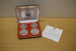 A 1972 Royal Canadian Mint Silver Four Coin Olympic Coin Set, 10 Dollar x2 and five Dollar x2, all