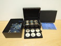 A Bradford Exchange 12 Crown sized Medallion Set, HM Queen Elizabeth II, Crowning Legacy