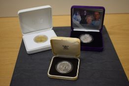 Three Royal Mint Silver Proof Crowns, 2011 William and Catherine gold plated, 1980 Queen Mother 80th