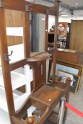 An early 20th Century oak hall stand, having Arts and Crafts style coat hooks, height approx. 200cm,